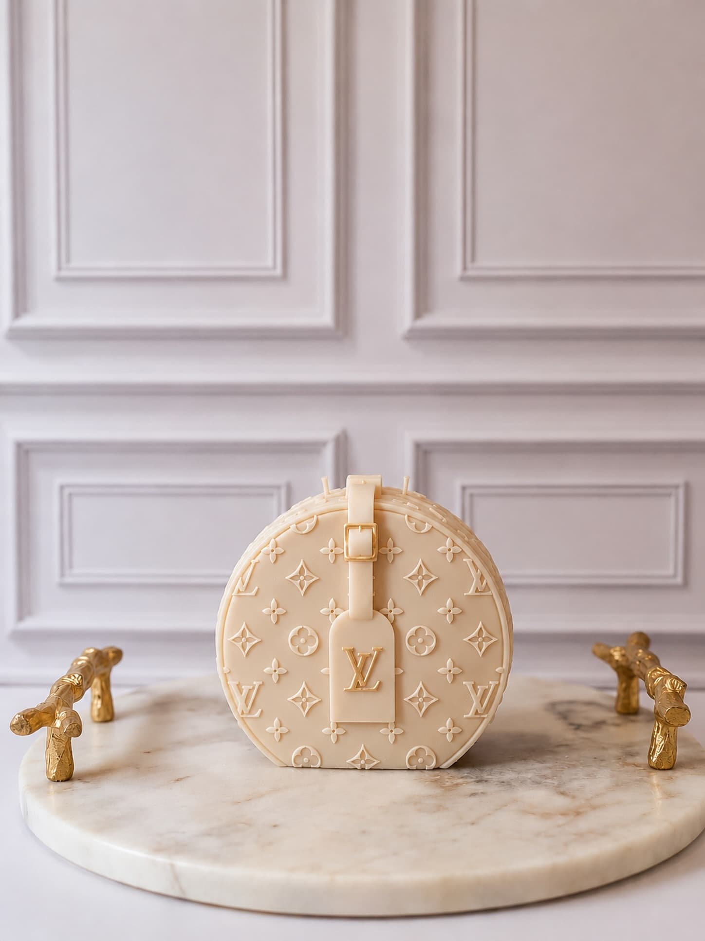 Ivory monogrammed round bag candle with gold luggage tag
