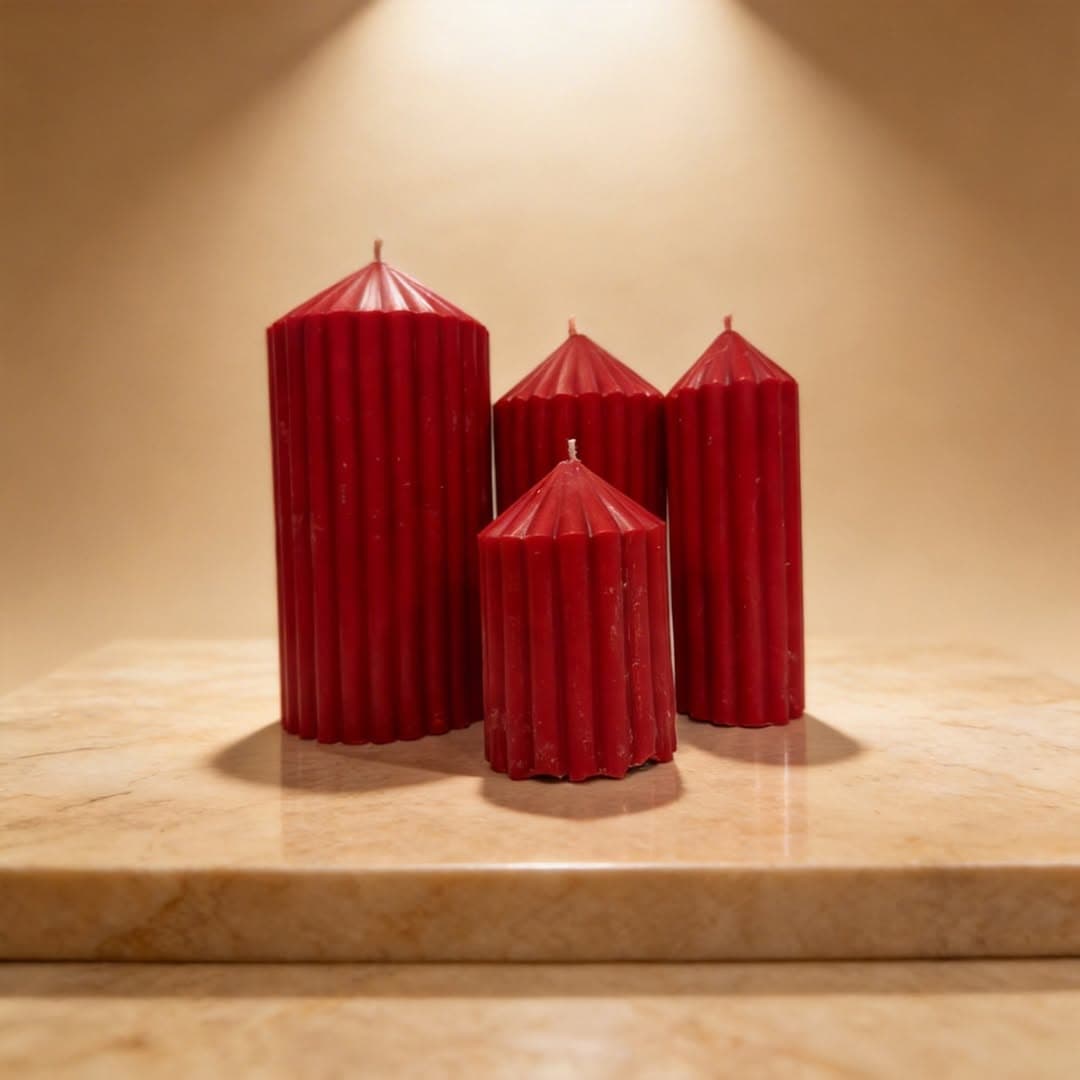 Set of four ribbed red pillar candles