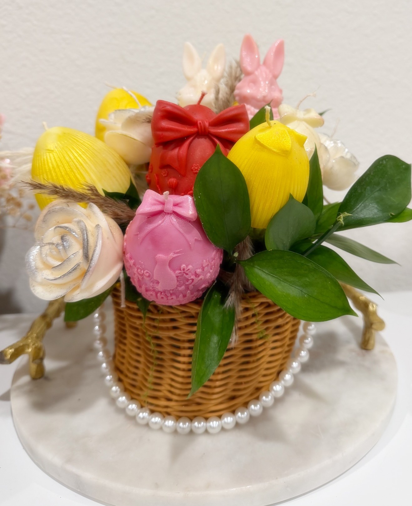 Easter basket with bunny candles, roses and pearls